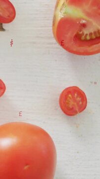 Vertical video: Tomato trio revealing while camera rising and zooming glyphs flashing to show seeds