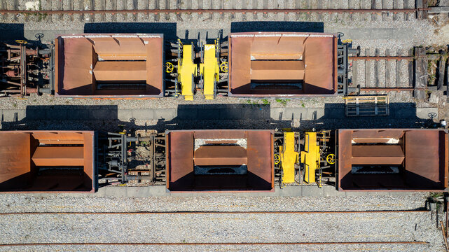 Aerial view of a train with open carriages, standing on the tracks under the sunlight, Vila Nova de Gaia, Porto District, Portugal.
