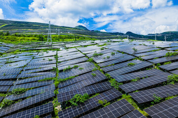 Photovoltaic solar panels at a vast mountain solar farm for sustainable green energy © ABCDstock