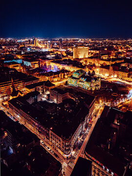 Aerial view of Zagreb's glowing cityscape, with its blend of architectural styles shining under the night sky, Zagreb, Croatia.