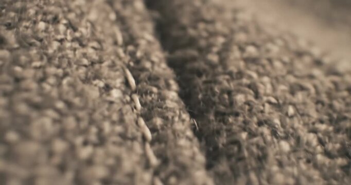 Brown carpet texture close-up view.