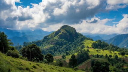 Fototapeta premium Lush green mountain landscape with rolling hills, dramatic clouds and sunlight for nature background wallpaper and scenic design