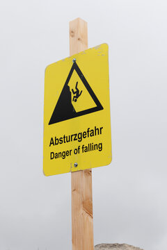 Warning sign: Danger of rockfall in the mountains