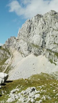 A majestic mountain landscape with steep rocky slopes of the highest point of Montenegro, Mount Bobotov Kuk