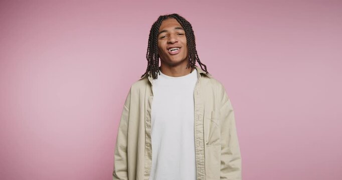 Joyful moments of self-expression captured in bright colors and smiling faces during a photoshoot in a cheerful studio setting