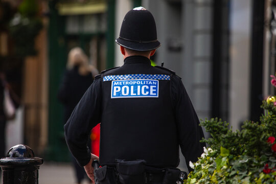 Metropolitan Police Officer on Patrol in Central London, UK