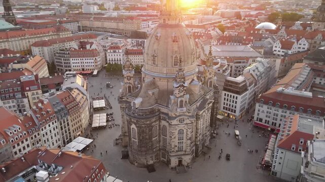 Majestic orbit around Frauenkirche with strong sunset lens flare