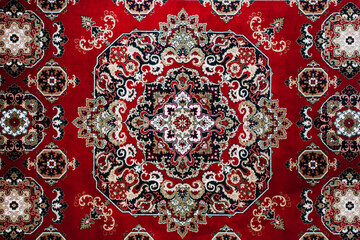 Classic red oriental rug with intricate floral mandala pattern © Great Brut Here