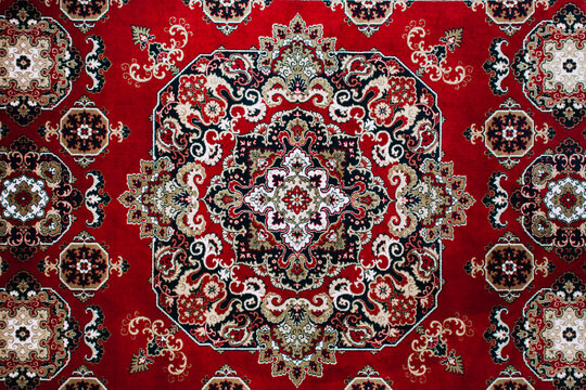 Classic red oriental rug with intricate floral mandala pattern