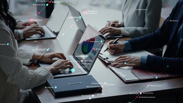 Conceptual image of a group of business people conversing in an office and digital technology.