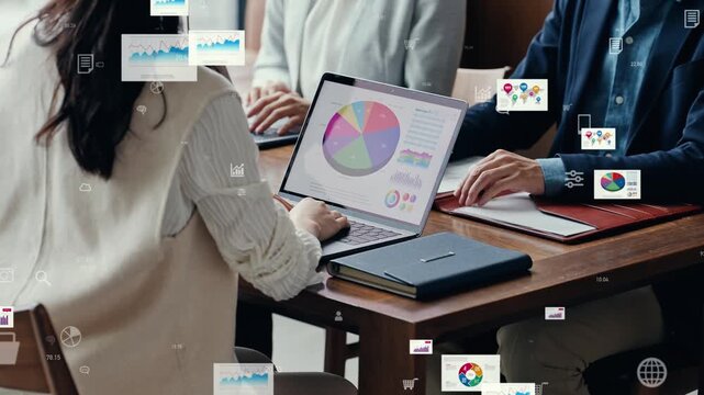 Conceptual image of a group of business people conversing in an office and business data.