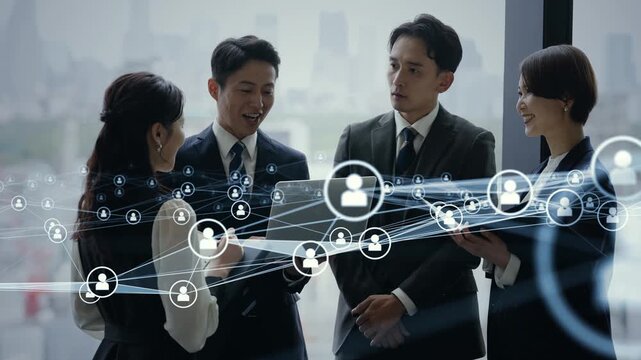 オフィスで会議するビジネスパーソンのグループと人材ネットワークのコンセプトイメージ