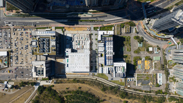 Aerial view of the Equinix Data Center in Tseung Kwan O with rooftop cooling units and large parking lots, New Territories, Hong Kong.