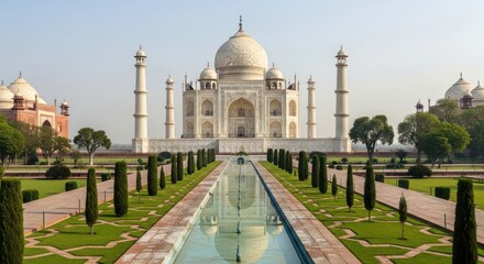 The majestic taj mahal viewed along a symmetrical garden pathway in agra india