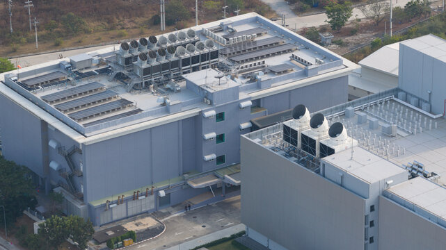 Aerial view of Data Centers Thailand featuring rooftop cooling units and solar panels in Tambon Don Huaro, Chang Wat Chon Buri, Thailand.