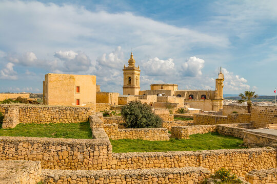 Citadel in Rabat, Gozo, Malta, on a sunny day, featuring historic stone walls, ancient architecture, and panoramic views over the island under bright Mediterranean skies.