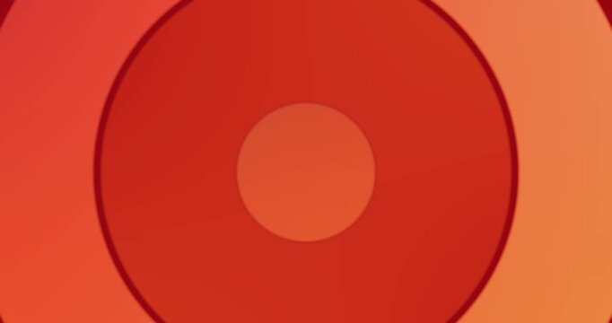 Animation of red mandala pattern in looping circles against pink background