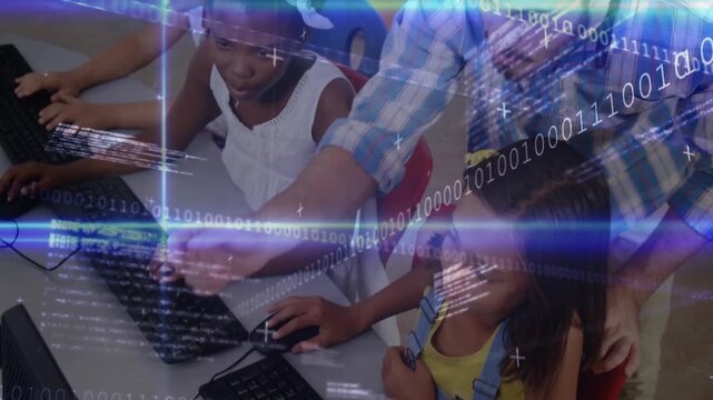 Teacher guiding student mouse and cursor movements for computer skills training in computer lab