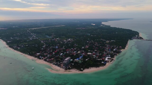 Aerial drone view of the pristine white sand beaches and emerald waters of Bantayan Island, Cebu, Philippines travel destination