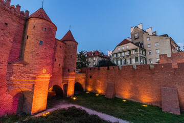 Fototapeta premium WARSAW,POLAND - AUGUST 3, 2022: Evening view of the Warsaw Barbican, part of the city fortification, Poland
