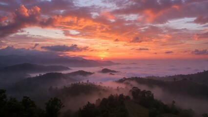 Fototapeta premium Sunrise sky over mist filled valleys and rolling hills
