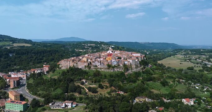 Panoramic aerial perspective of historic Orte city Italy summer. Drone view of colorful old houses and church dome. Authentic Italian life and architectural heritage travel concept.