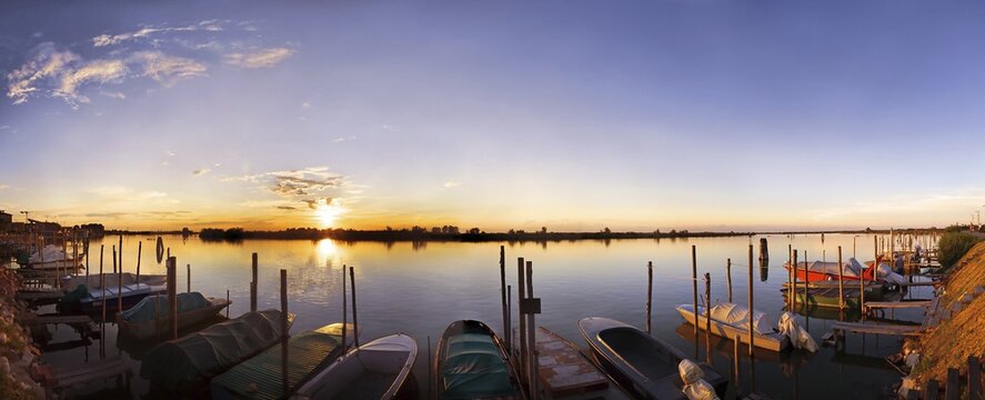 Sunset in Cavallino Harbour, fishing boats, view of lagoon, Venice, Italy