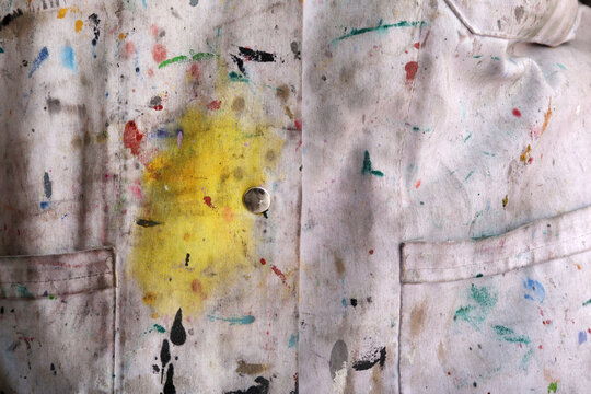 paint stains on the artist's apron