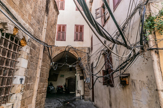 Narrow alley with many cables in the old town of Sidon, Lebanon