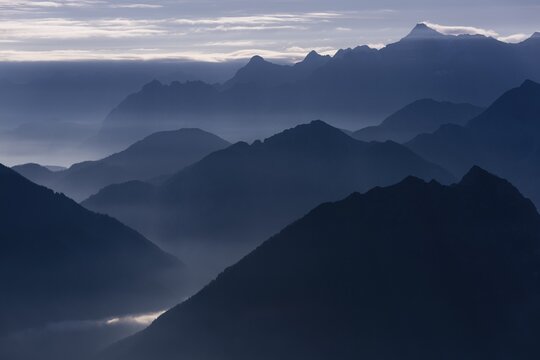 Blue hour with mountain peaks of the Ammer Mountains, Mt. Zugspitze at the back, Reutte, Au&szlig;erfern, Tyrol, Austria