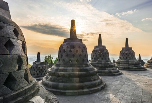 Borobudur temple at sunrise, stupas, cloudy sky, Borobudur, Yogyakarta, Java, Indonesia