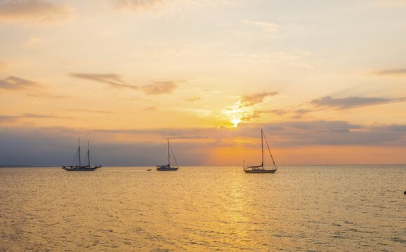 Sunrise, sailboats in the sea, Lovina Beach, Bali, Indonesia