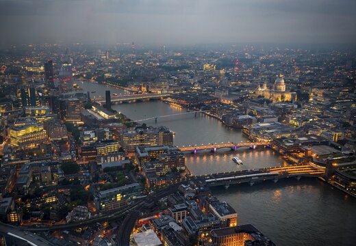 View of River Thames with London Bridge, Millenium Bridge and St. Paul's Cathedral, dusk, aerial view, London, England, United Kingdom