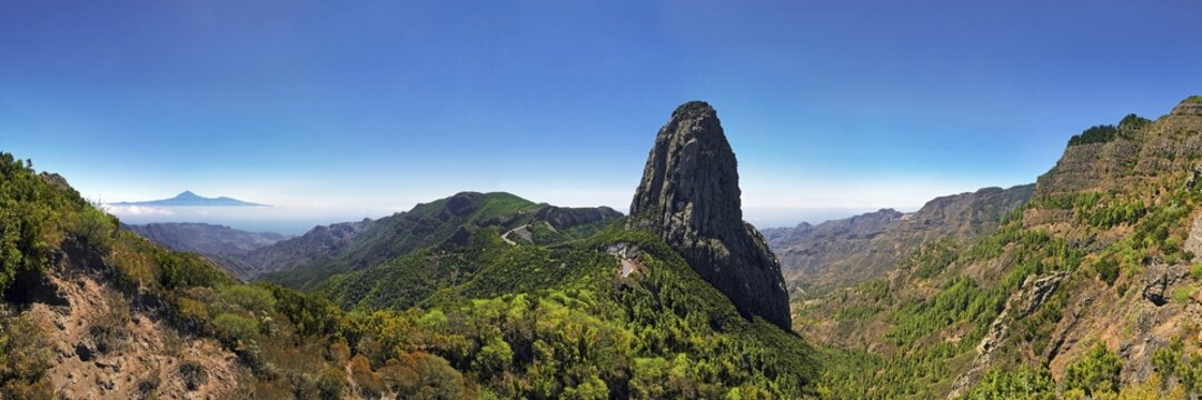 Roque de Agando with Tenerife in the distance, La Gomera, Canary Islands, Spain, Europe