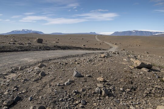 Lonely gravel road through volcanic landscape, volcanic desert, road F35, Kjalvegur, Kj&ouml;lur, highlands, Iceland