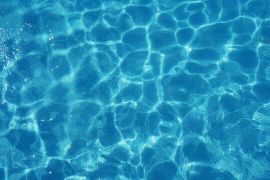 Swimming pool texture. Having fun on vacation at the hotel pool. Colorful vacation concept.