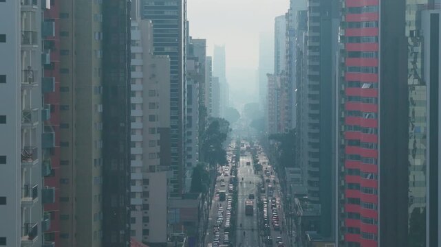 Curitiba morning mist with busy city traffic and foggy skyline in Curitiba, Brazil