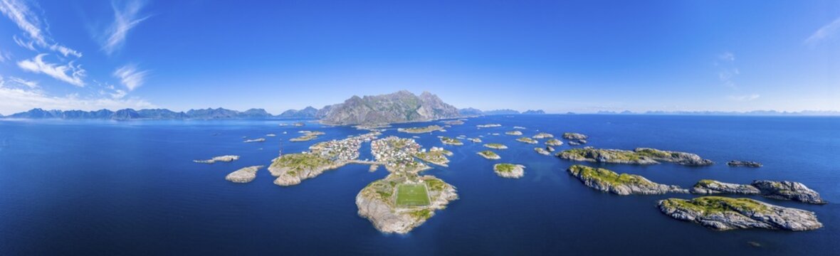 Aerial view, Henningsvaer with football stadium, rock islands in the sea off Bergen, Festv&aring;gtinden, Vestv&aring;g&oslash;y, Lofoten, Nordland, Norway