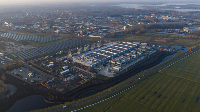Aerial view of the Datacenter Winschoten facility with its large industrial buildings and adjacent solar panel arrays Winschoten, Groningen, Netherlands.