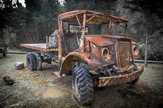 Old rusty car in forest, Inangahua, West Coast Region, Southland, New Zealand
