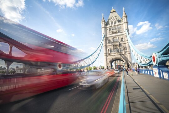 Red double-decker bus on the Tower Bridge, motion blur, Tower Bridge, London, England, Great Britain