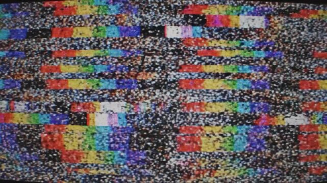 Abstract pattern of colorful horizontal bars and static noise on a screen, representing digital interference or a retro television broadcast