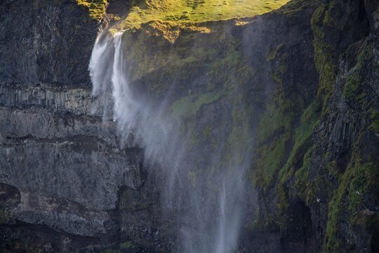 Waterfall falls over cliff and is blown away by wind, Skagi Peninsula, Skagafj&ouml;r&eth;ur, Nor&eth;urland vestra, Iceland