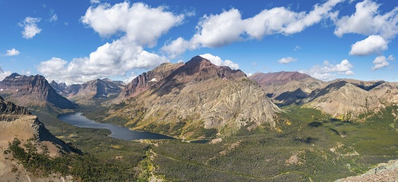 View of Two Medicine Lake, mountain peaks Rising Wolf Mountain and Sinopah Mountain, hiking trail to Scenic Point, Glacier National Park, Montana, USA
