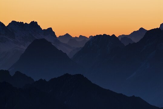 Sunrise with rows of mountains, Namlos, Reutte, Tyrol, Austria, Europe