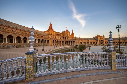 Bridge over canal, bridge railing with painted azulejo tiles, Plaza de Espa&ntilde;a in the evening light, Sevilla, Andalusia, Spain
