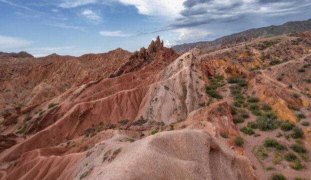Canyon of eroded sandstone formations, red and orange sandstone rocks, fairytale gorge, Skazka, Tosor, Kyrgyzstan