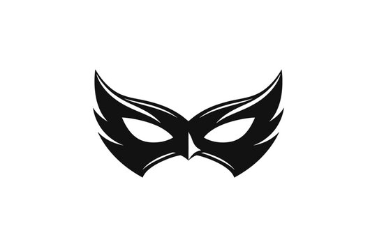 A mysterious black mask with wing-like designs on a white background, perfect for themes of secrecy and anonymity.