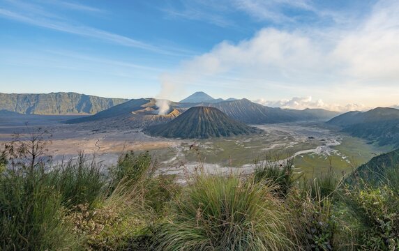 View of volcanic landscape, volcanoes, smoking volcano Gunung Bromo, Mt. Batok, Mt. Kursi, Mt. Gunung Semeru, Bromo-Tengger-Semeru National Park, Java, Indonesia