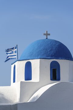 Blue and White Greek Orthodox Church Agios Nikolaos with Greek Flag, Parikia, Paros, Cyclades, Aegean Sea, Greece